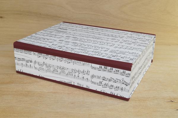 Large box with burgundy linen edges and musical notes motif